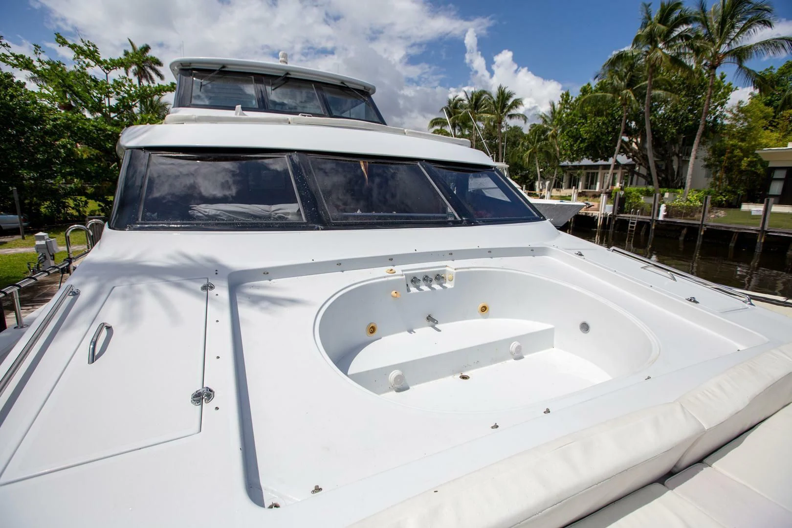 a white boat with a white roof aboard PAINKILLER Yacht for Sale
