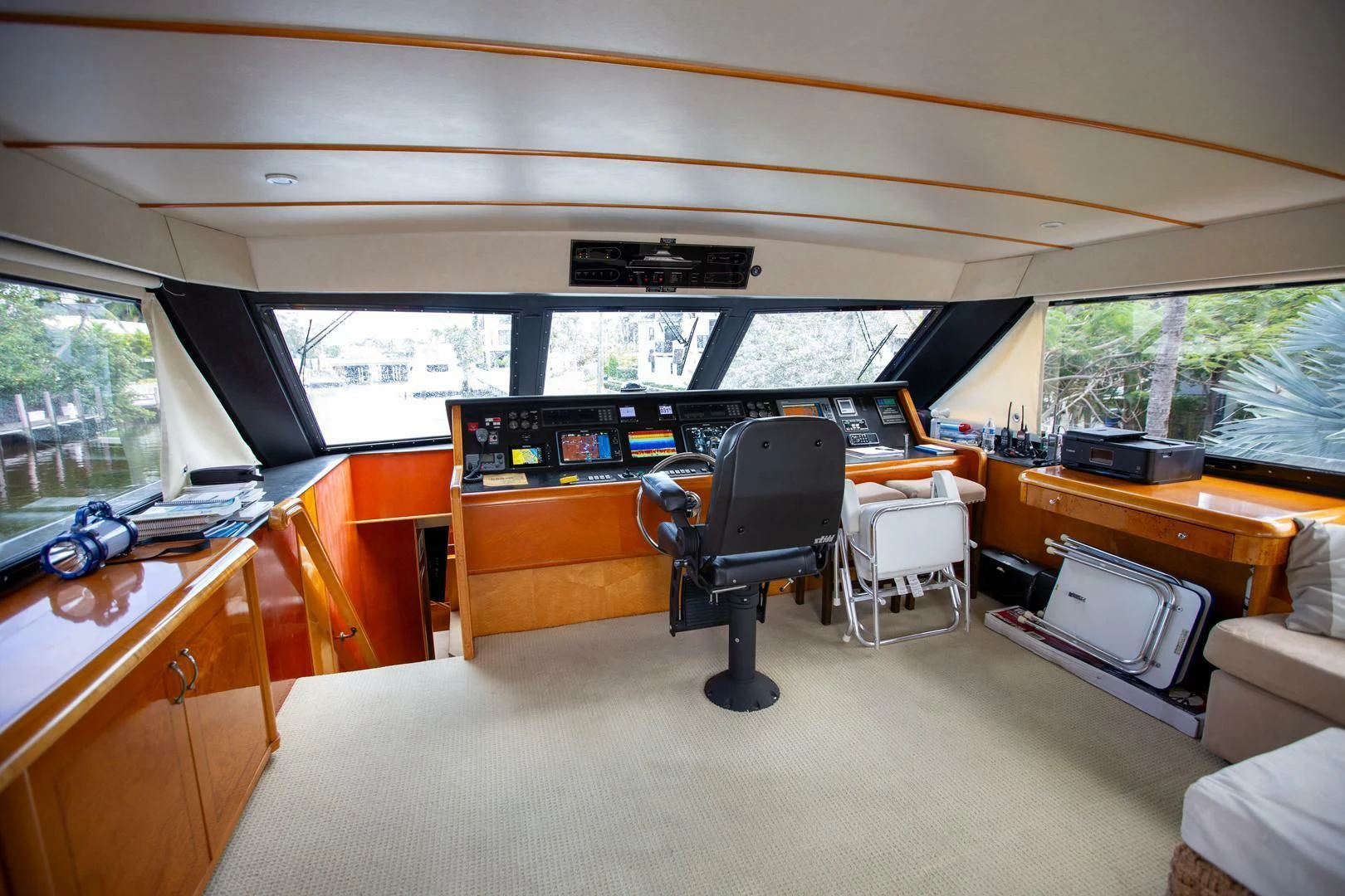 a room with a piano and a chair aboard PAINKILLER Yacht for Sale