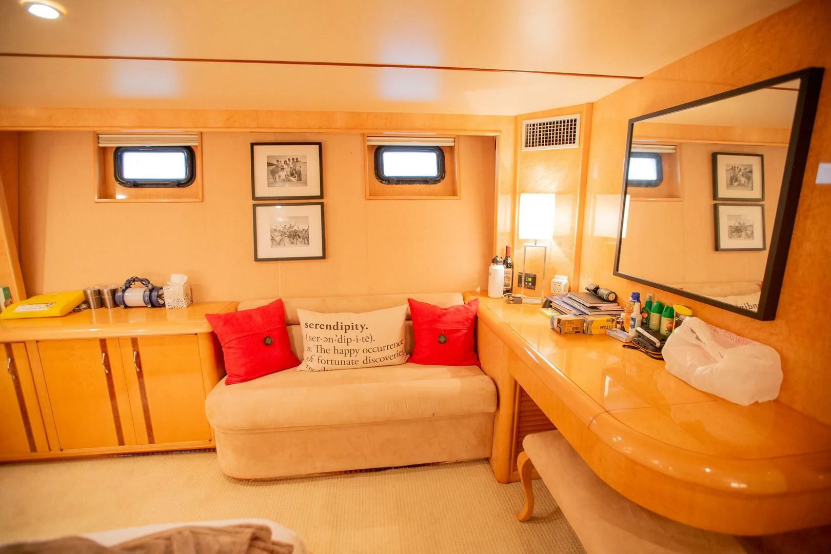 a living room with a couch and a table aboard PAINKILLER Yacht for Sale
