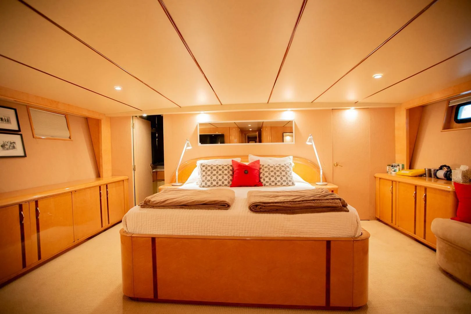 a bedroom with a bed and a desk aboard PAINKILLER Yacht for Sale