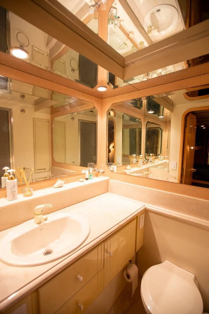 a bathroom with a sink and a toilet aboard PAINKILLER Yacht for Sale