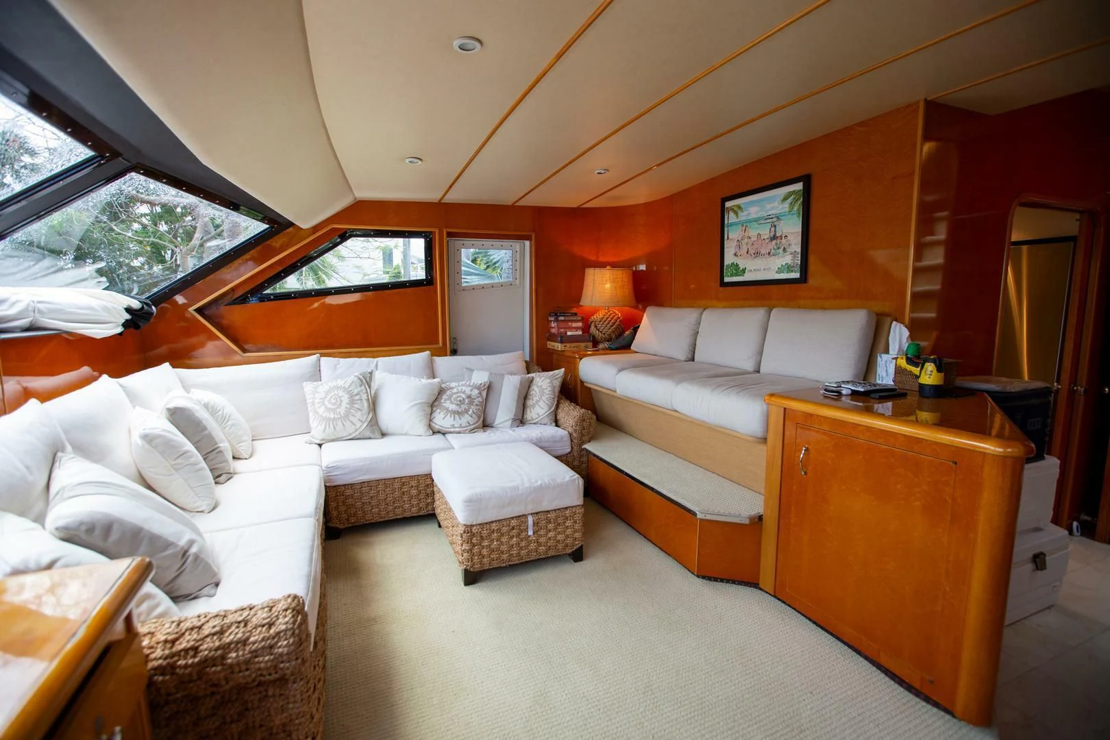 a living room with a couch and a table aboard PAINKILLER Yacht for Sale