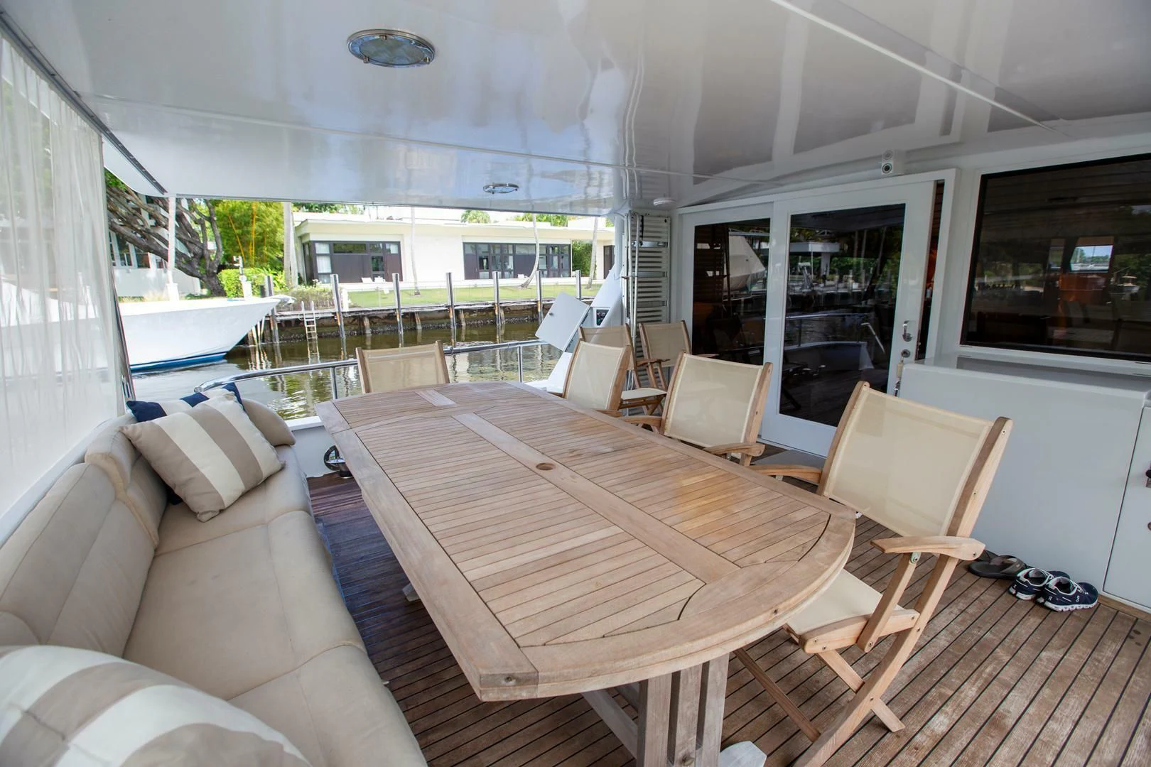 a living room with a table and chairs aboard PAINKILLER Yacht for Sale