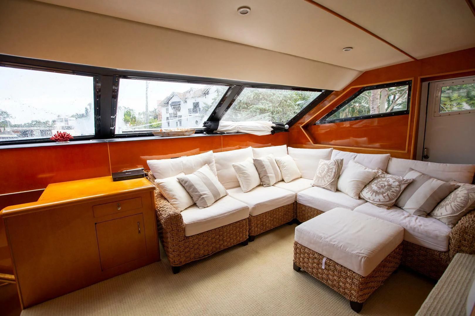 a living room with a couch and a window aboard PAINKILLER Yacht for Sale