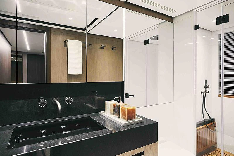 a bathroom with a sink and a mirror aboard BACCHANAL Yacht for Sale