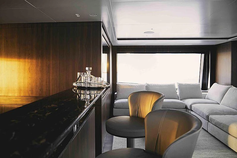 a kitchen with a bar and a bar aboard BACCHANAL Yacht for Sale