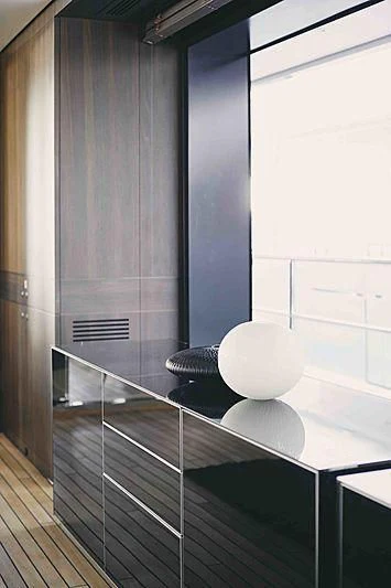 a white lamp on a glass table aboard BACCHANAL Yacht for Sale