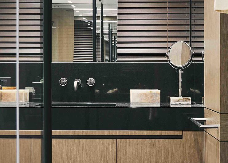 a black cabinet with a mirror aboard BACCHANAL Yacht for Sale