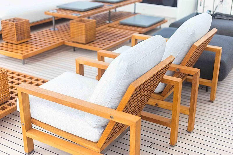 wooden chairs in a room aboard BACCHANAL Yacht for Sale
