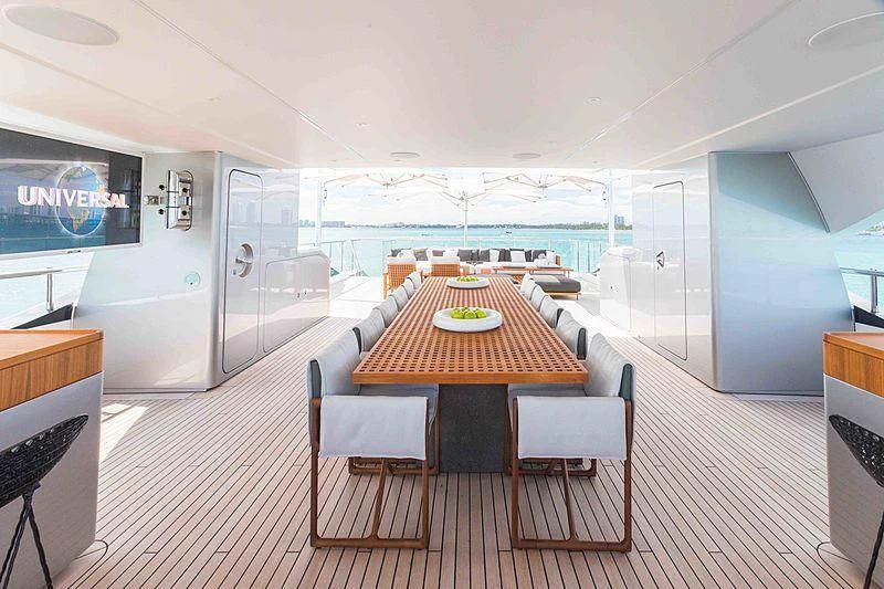 a room with a table and chairs aboard BACCHANAL Yacht for Sale