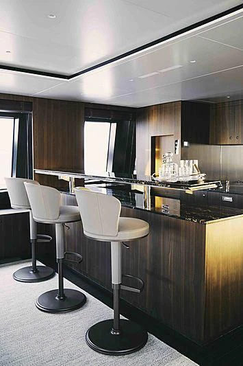 a room with a table and chairs aboard BACCHANAL Yacht for Sale