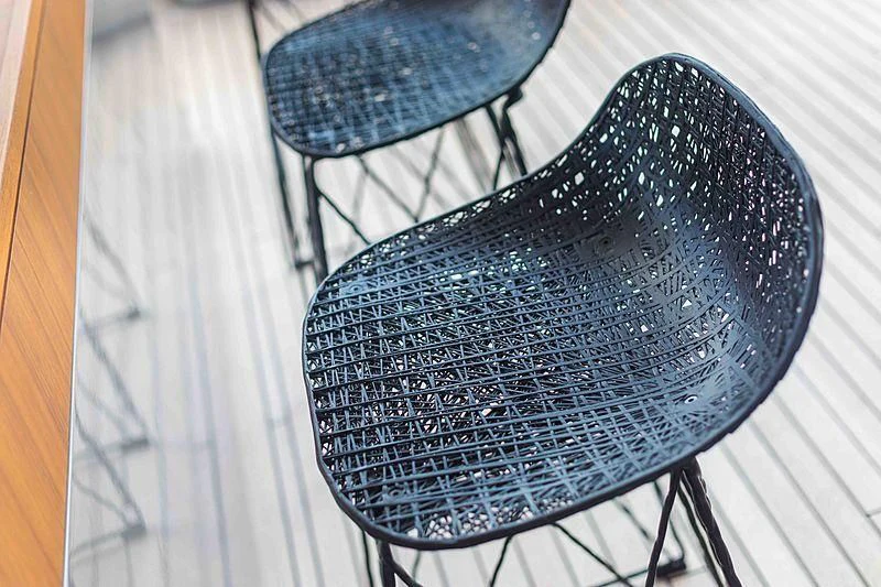 a pair of blue chairs aboard BACCHANAL Yacht for Sale