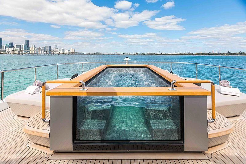 a swimming pool on a deck aboard BACCHANAL Yacht for Sale