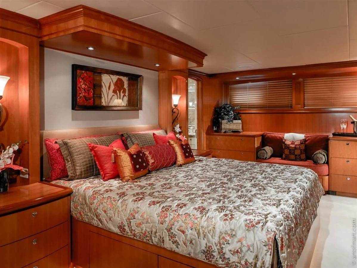 a bedroom with a bed and a couch aboard MURPHY'S LAW Yacht for Charter
