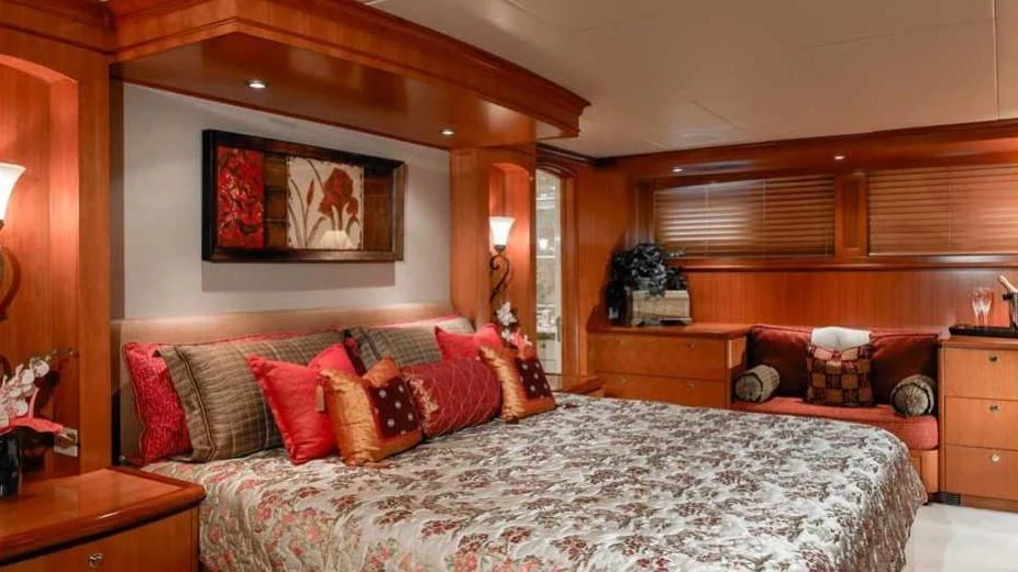a bedroom with a bed and a couch aboard MURPHY'S LAW Yacht for Charter