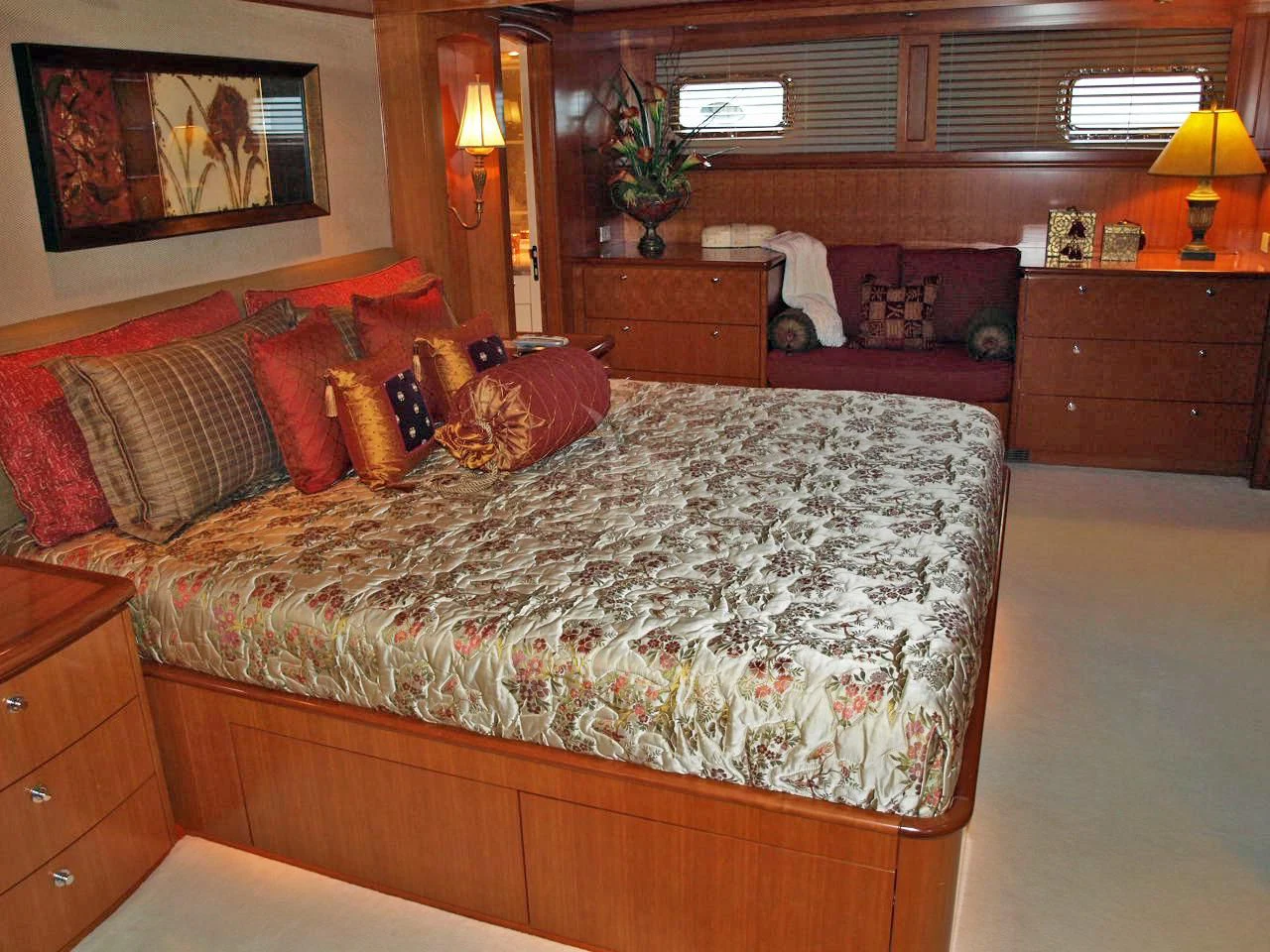 a bedroom with a bed and a couch aboard MURPHY'S LAW Yacht for Charter