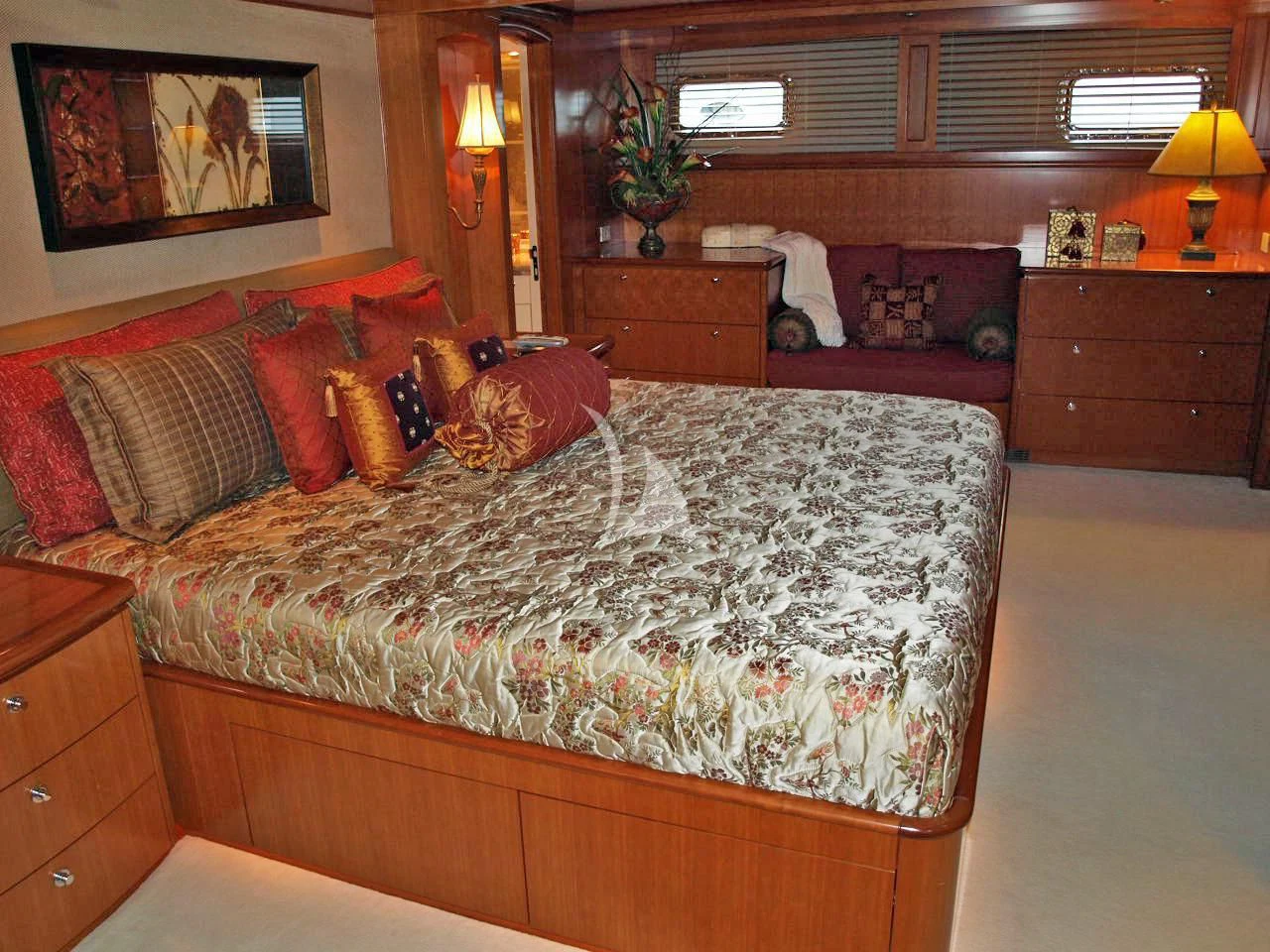 a bedroom with a bed and a couch aboard MURPHY'S LAW Yacht for Charter