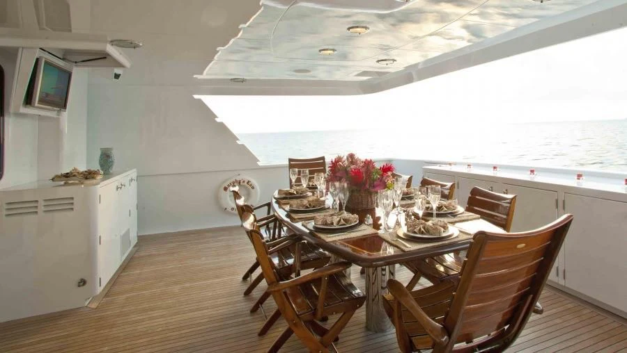 a dining room with a table and chairs aboard MURPHY'S LAW Yacht for Charter