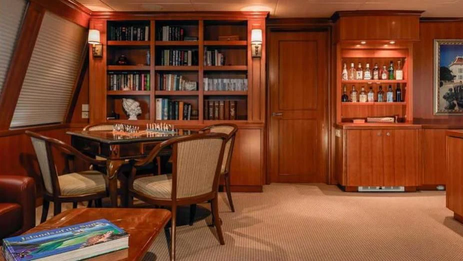 a room with a table and chairs aboard MURPHY'S LAW Yacht for Charter