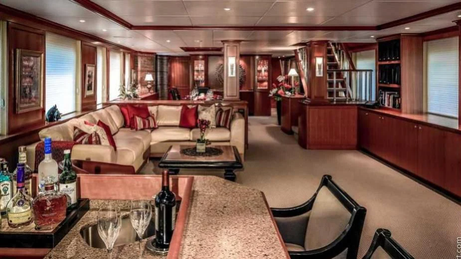 a living room with a couch and a table aboard MURPHY'S LAW Yacht for Charter