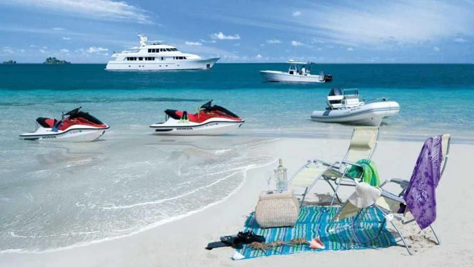 boats and a chair on a beach aboard MURPHY'S LAW Yacht for Charter