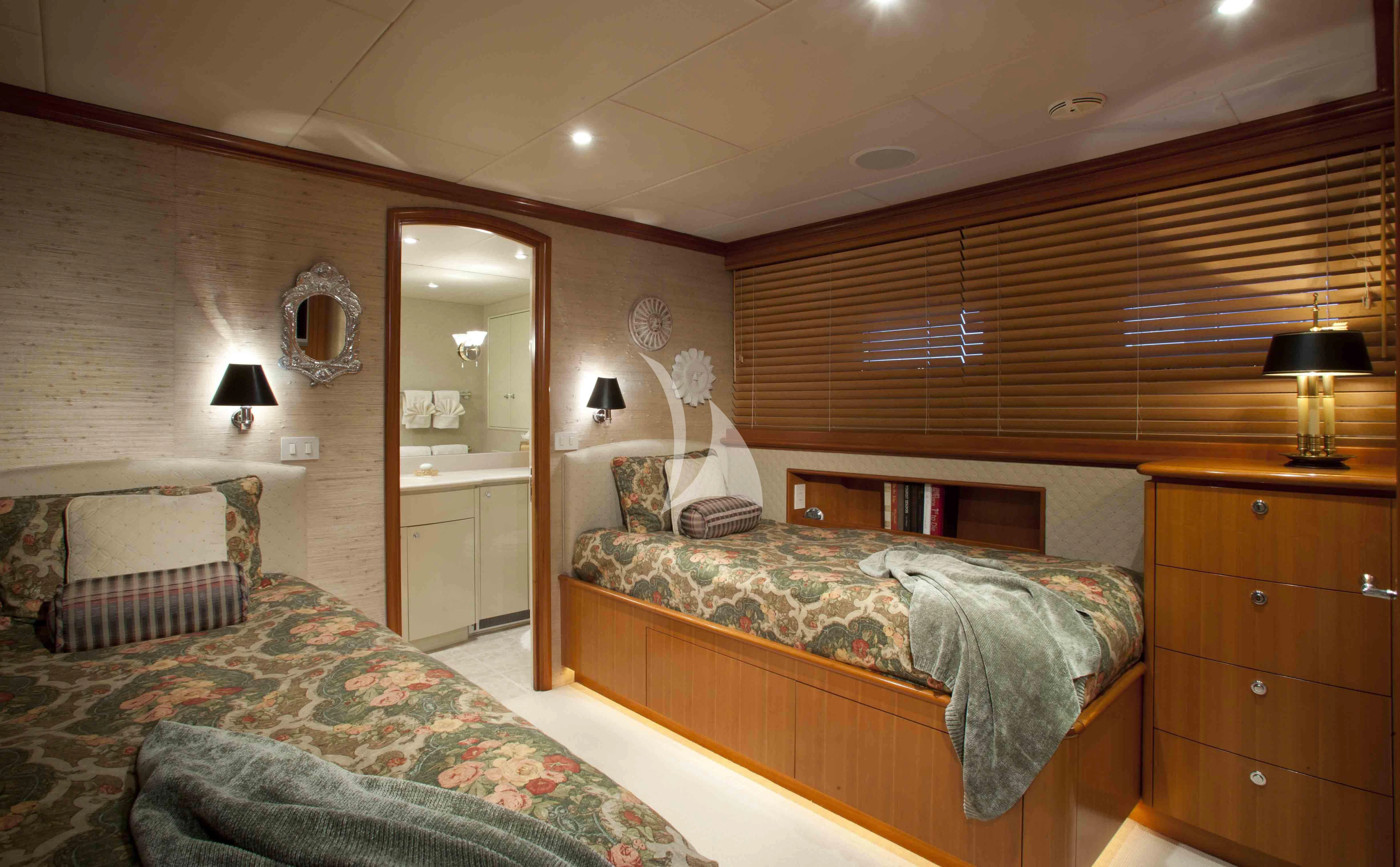 a bedroom with a bed and a mirror aboard MURPHY'S LAW Yacht for Charter