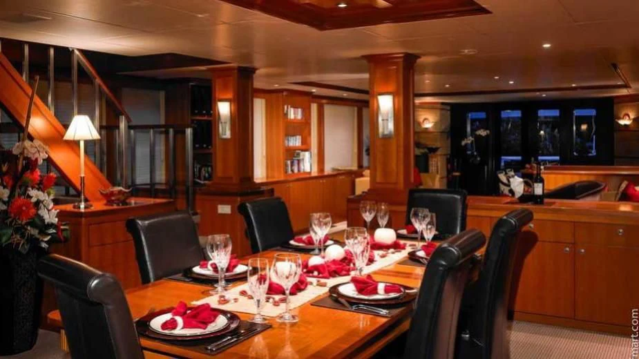 a dining room with a table set aboard MURPHY'S LAW Yacht for Charter