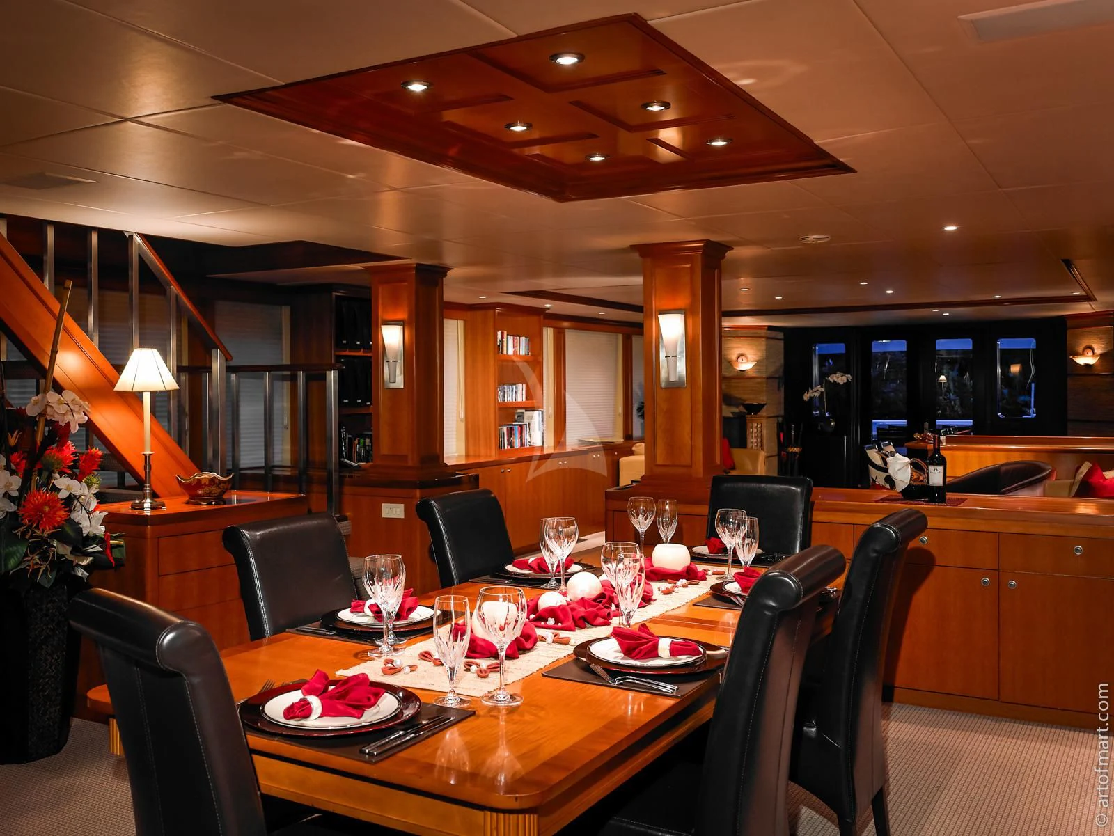 a large dining room with a table set for dinner aboard MURPHY'S LAW Yacht for Charter