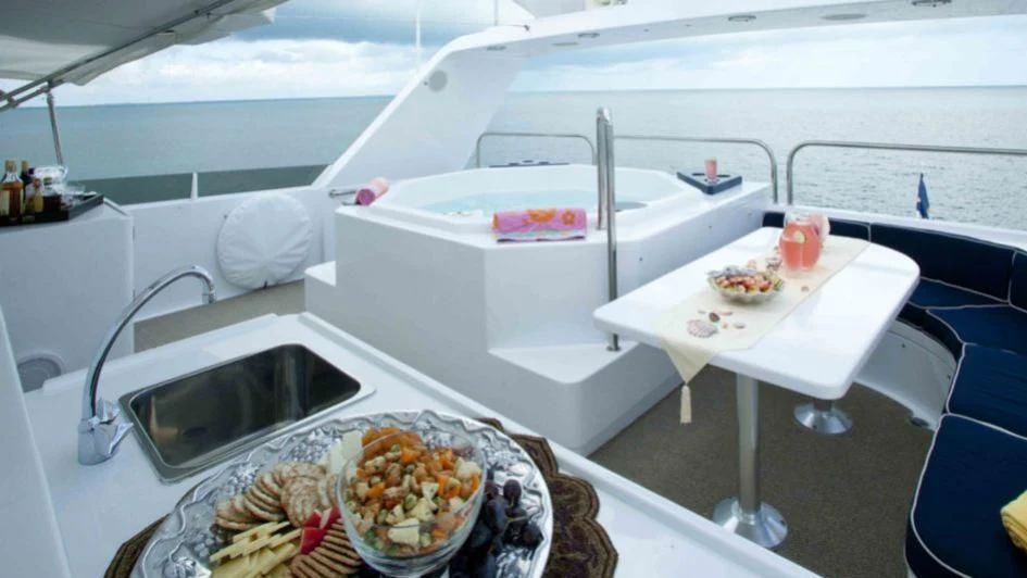 a white table with food on it aboard MURPHY'S LAW Yacht for Charter