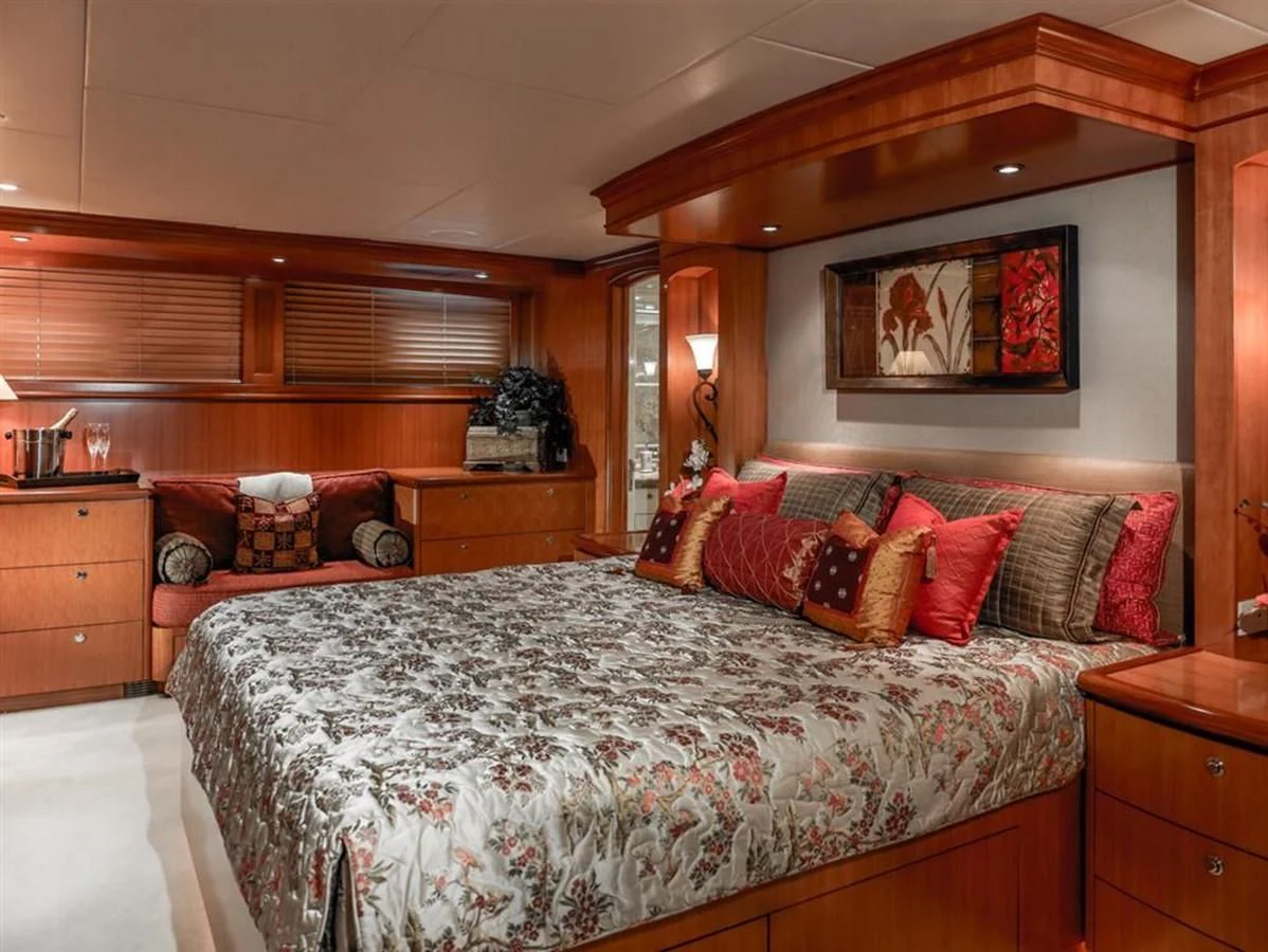 a bedroom with a bed and a couch aboard MURPHY'S LAW Yacht for Charter