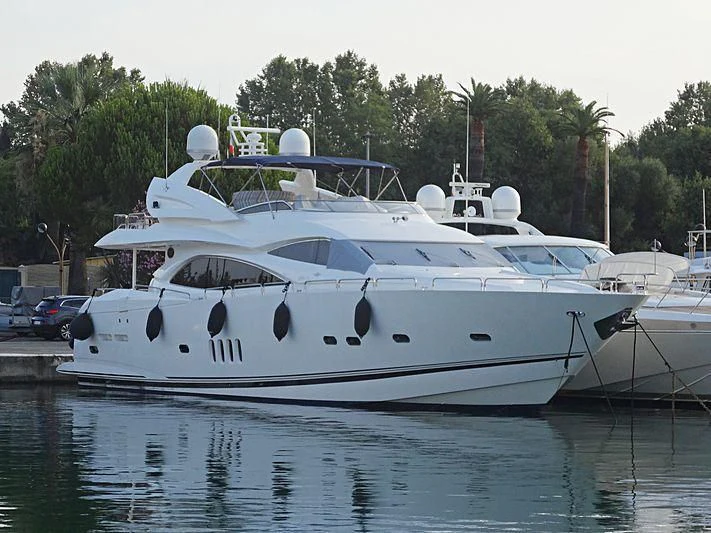 a white boat in a harbor aboard PEARL OF LONDON Yacht for Sale