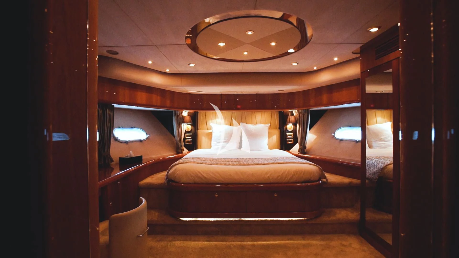 a room with a bed and a window aboard PEARL OF LONDON Yacht for Sale