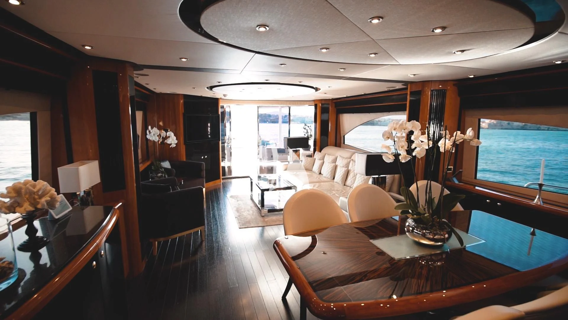 a room with a table and chairs aboard PEARL OF LONDON Yacht for Sale