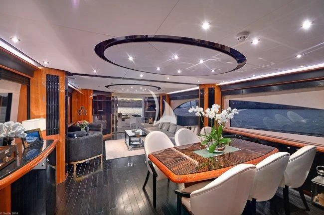 a room with tables and chairs aboard PEARL OF LONDON Yacht for Sale