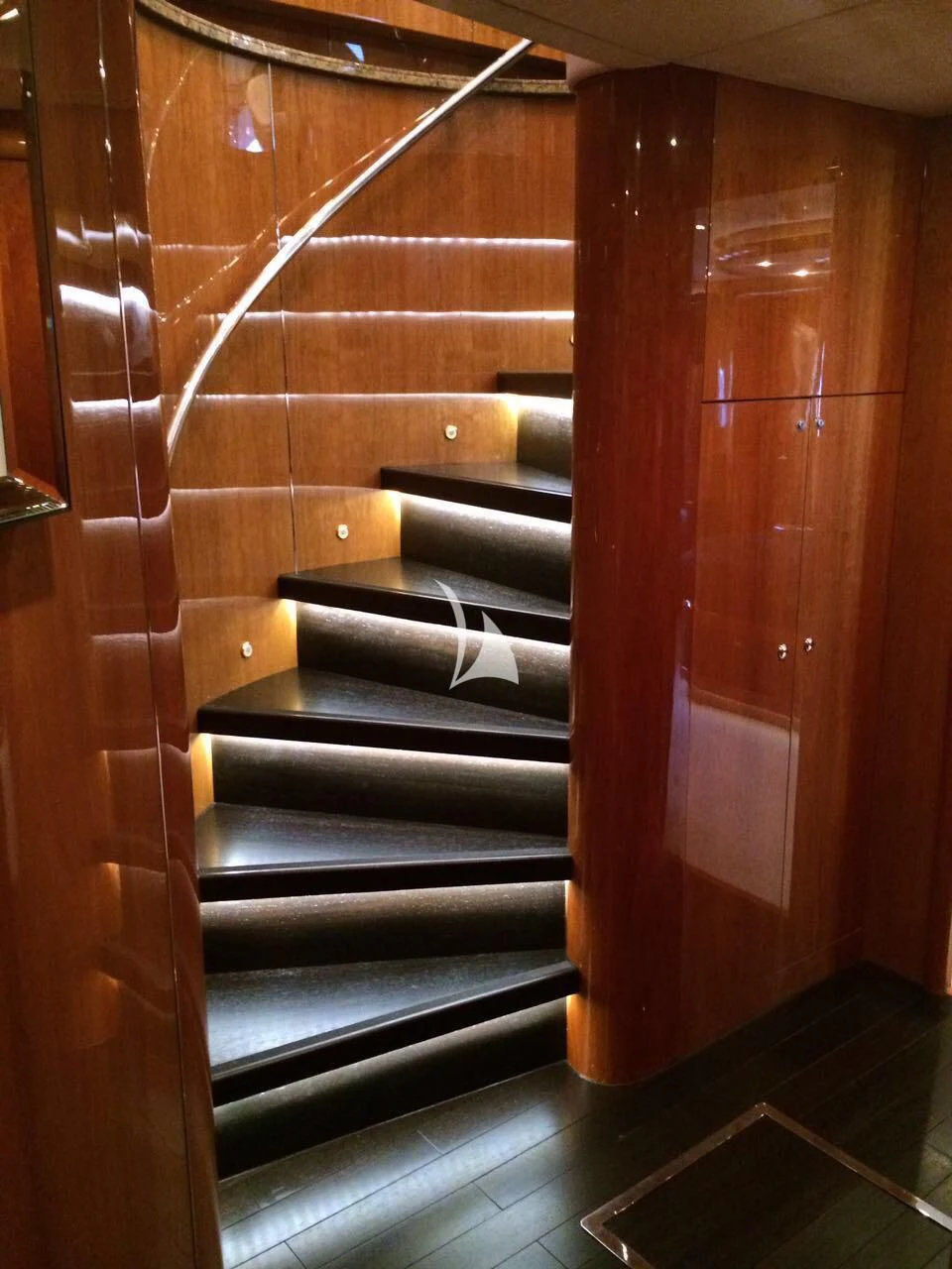 a wooden staircase with glass doors aboard PEARL OF LONDON Yacht for Sale