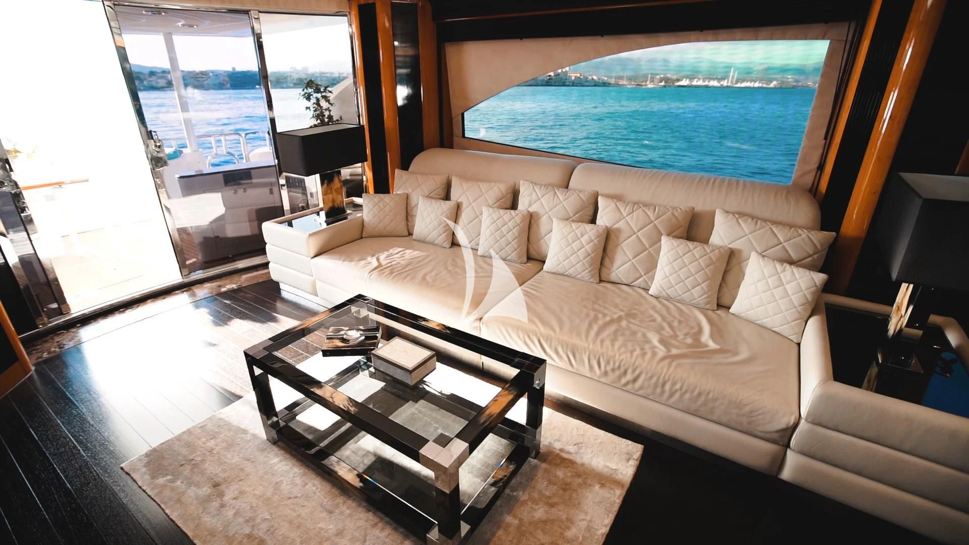 a living room with a large window aboard PEARL OF LONDON Yacht for Sale