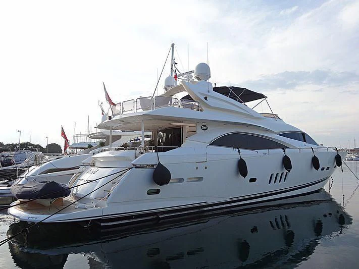 a white yacht in a harbor aboard PEARL OF LONDON Yacht for Sale