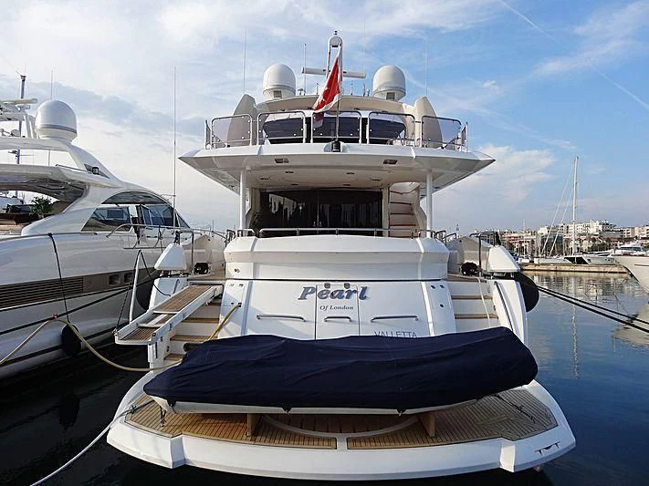 a boat docked at a pier aboard PEARL OF LONDON Yacht for Sale