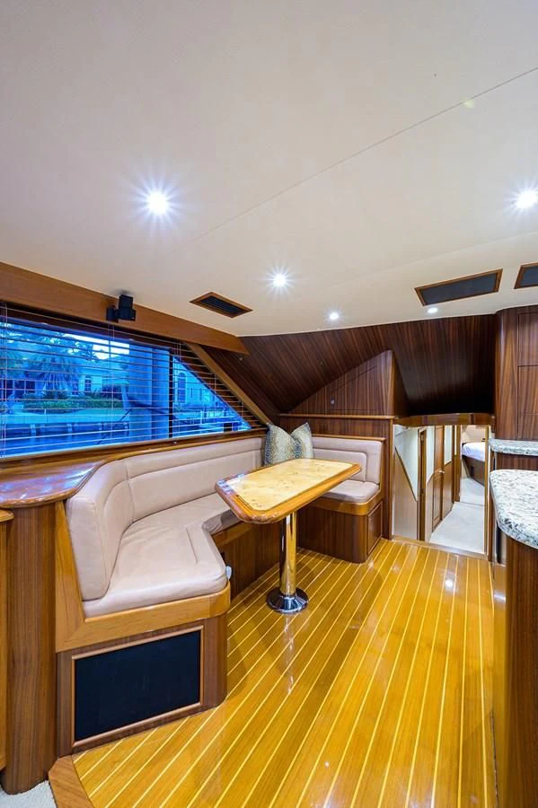 a room with a couch and a table aboard FLYING J Yacht for Sale
