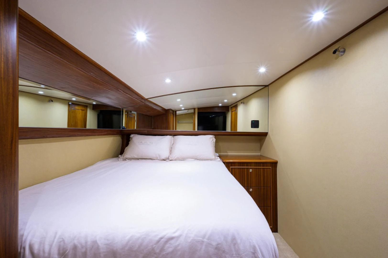 a bed with white sheets aboard FLYING J Yacht for Sale