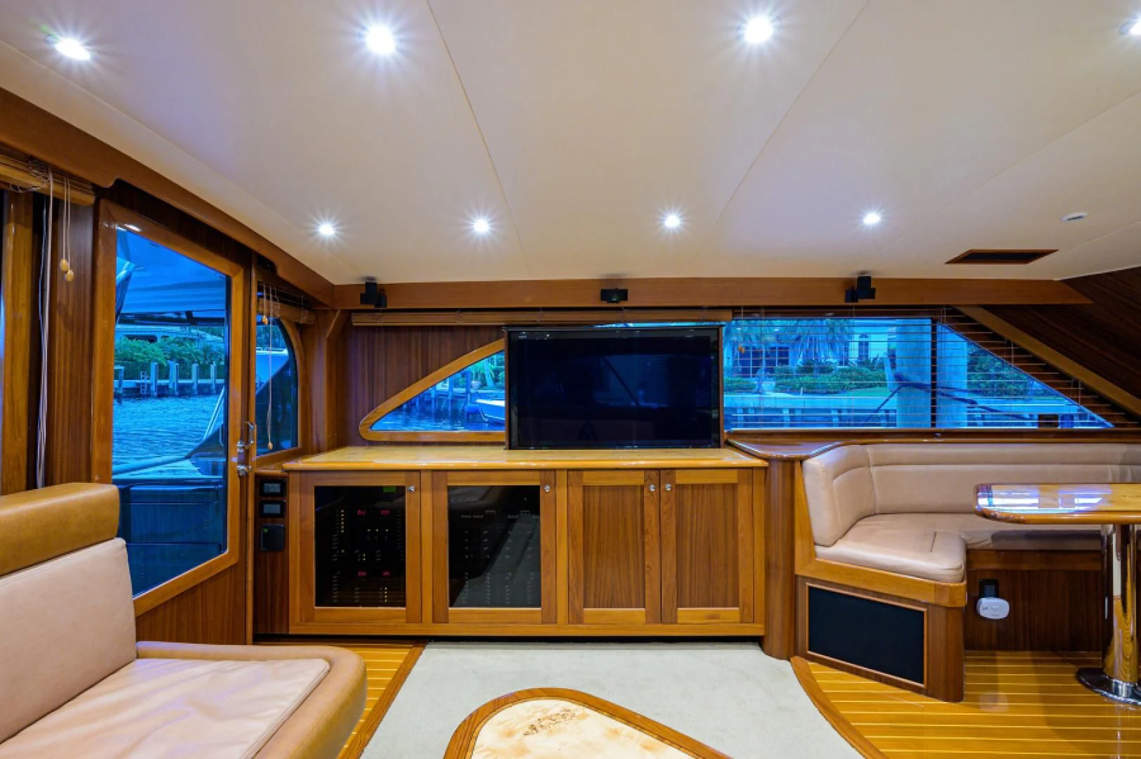 a room with a large tv and a large window aboard FLYING J Yacht for Sale