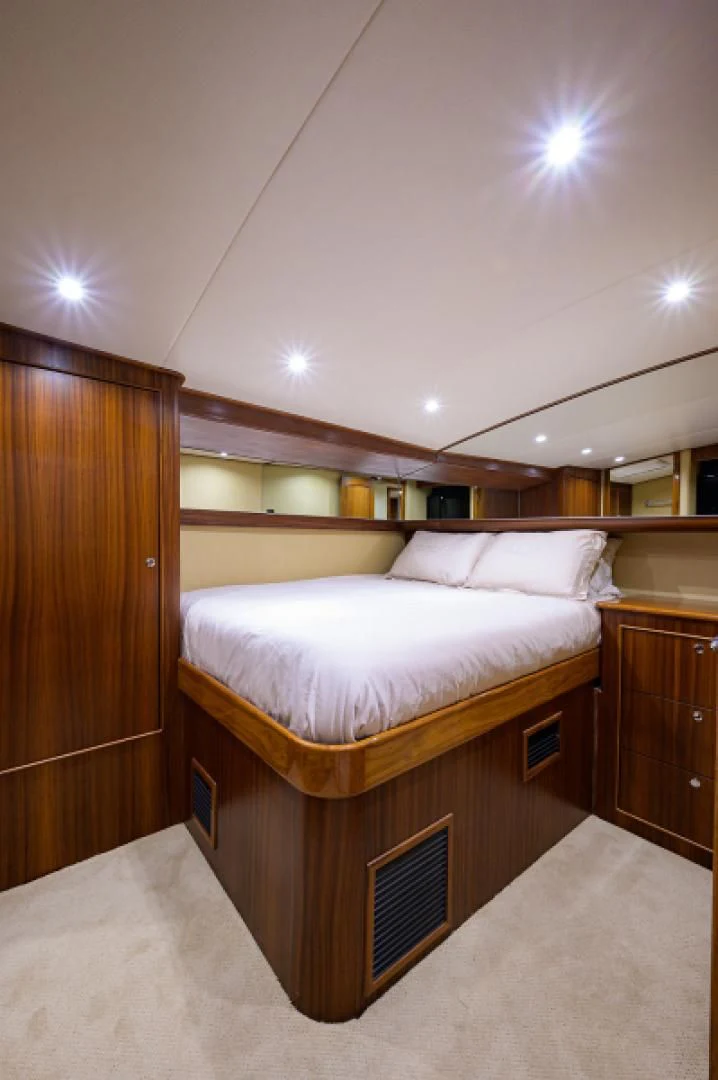 a bed in a room aboard FLYING J Yacht for Sale