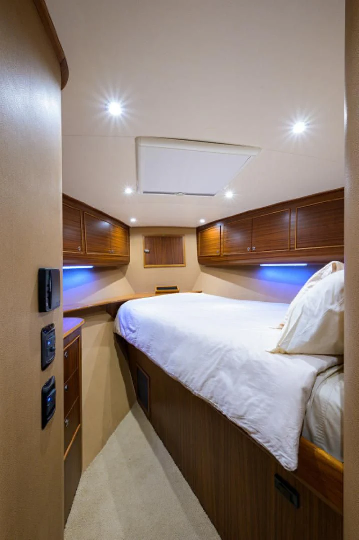 a room with a bed and a desk aboard FLYING J Yacht for Sale