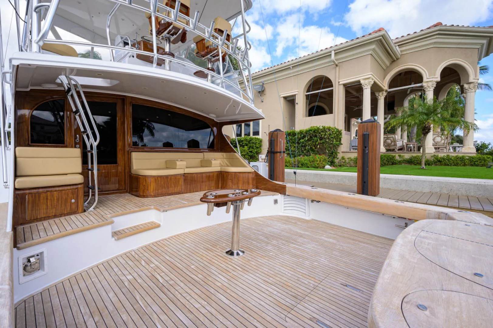 a deck with a table and chairs aboard FLYING J Yacht for Sale