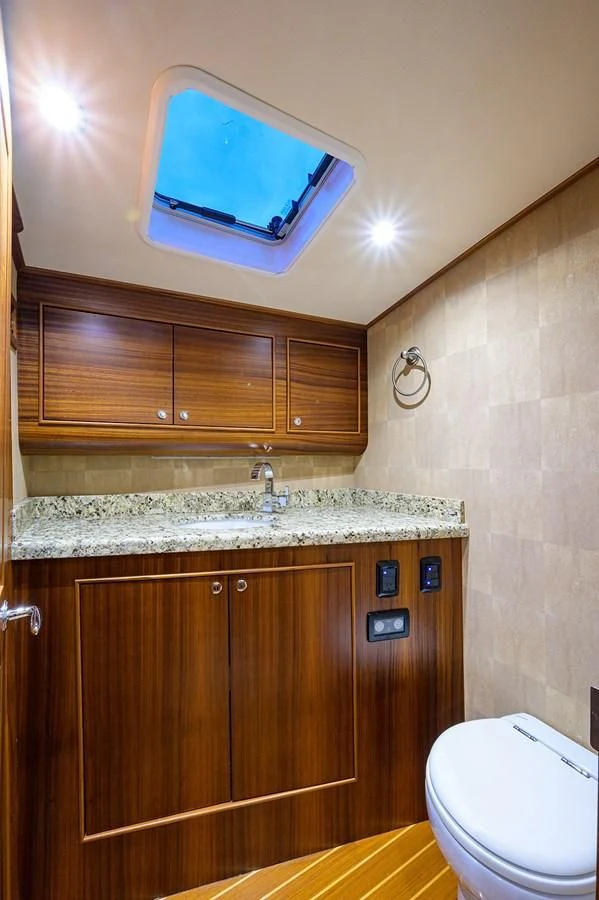 a bathroom with a large sink aboard FLYING J Yacht for Sale