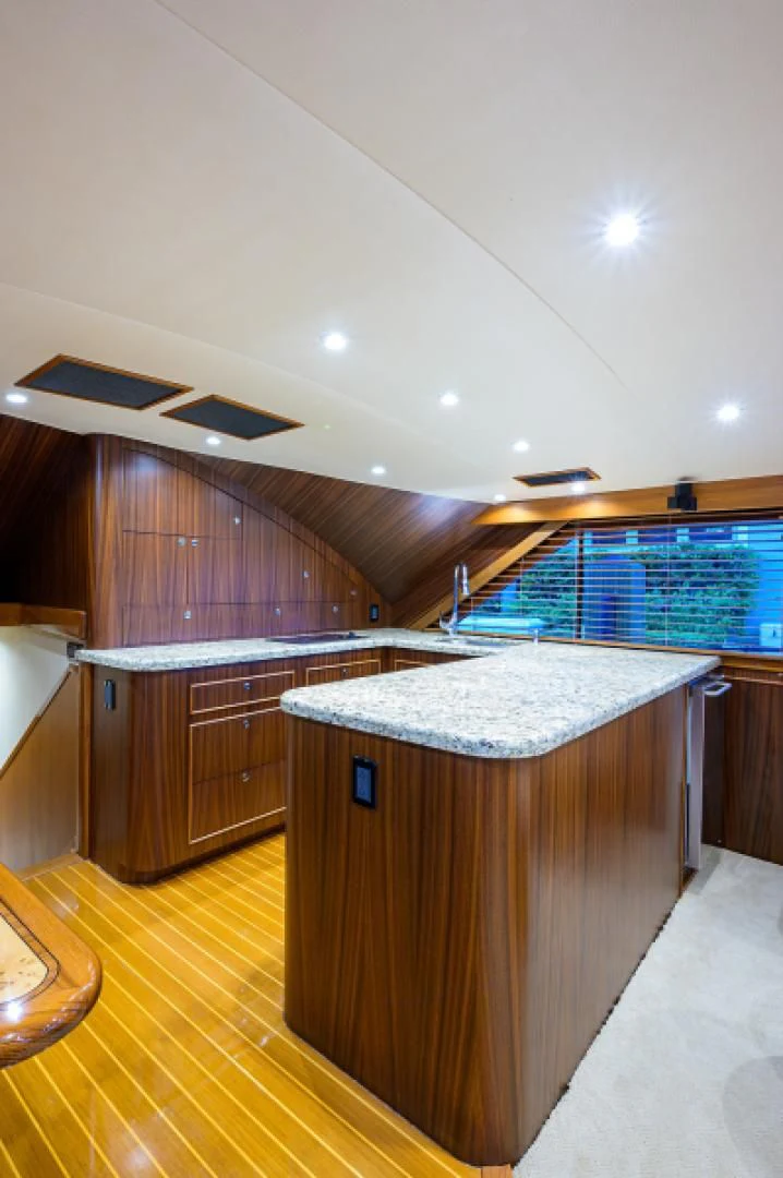 a kitchen with a large island aboard FLYING J Yacht for Sale