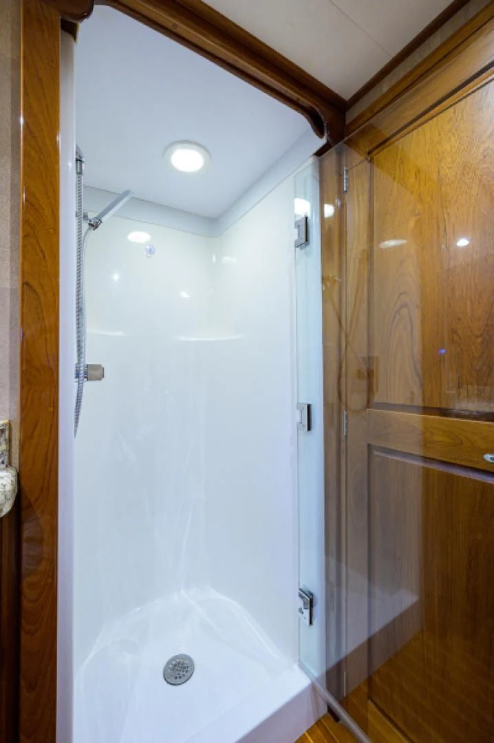 a white door with a glass wall aboard FLYING J Yacht for Sale