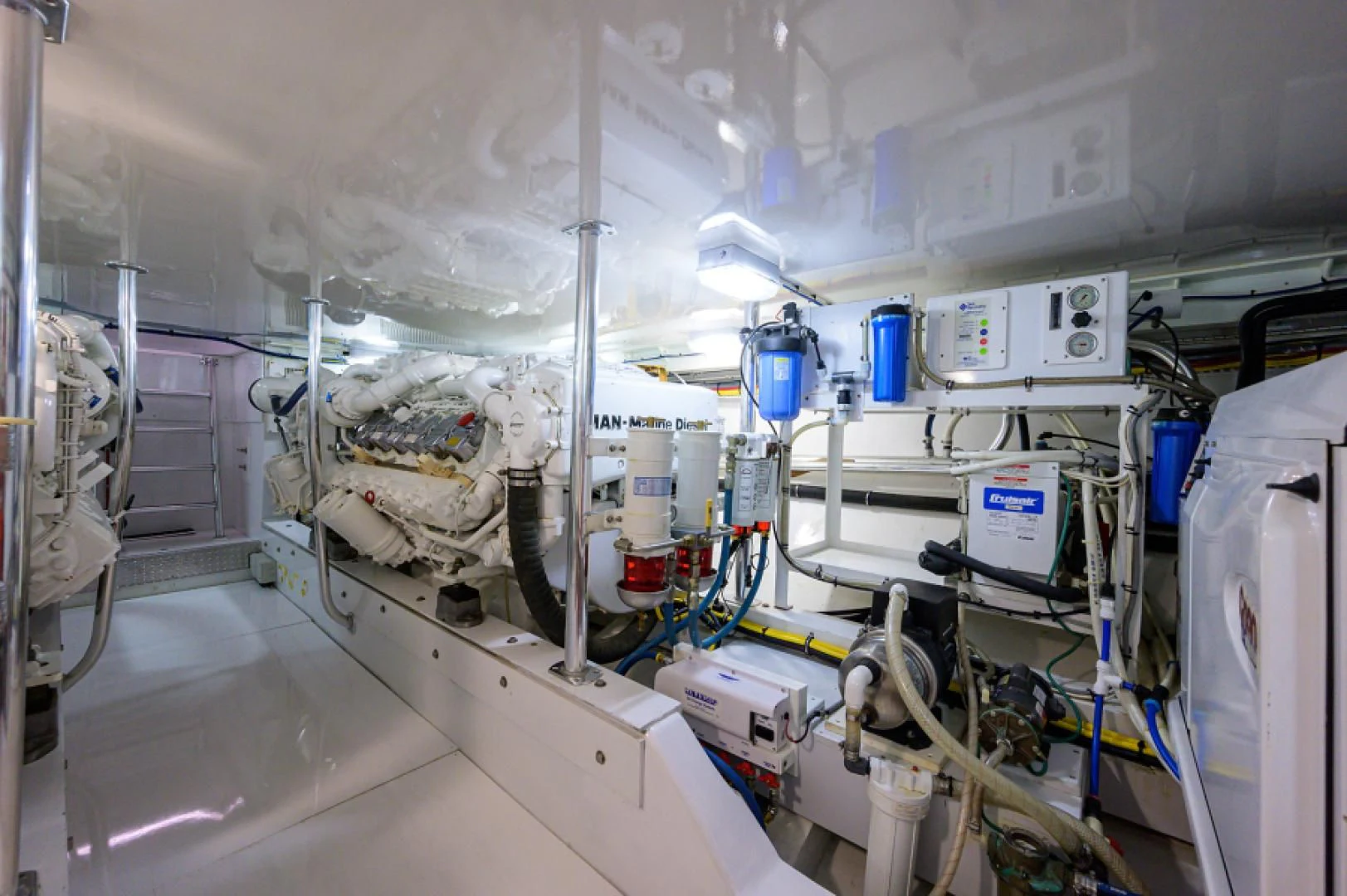 a room with white pipes and blue pipes aboard FLYING J Yacht for Sale