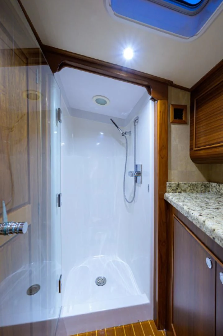 a shower unit in a bathroom aboard FLYING J Yacht for Sale