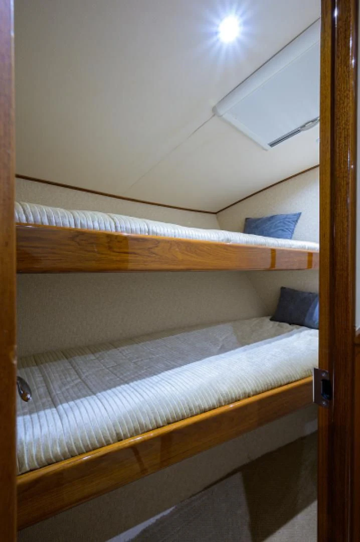 a room with two beds aboard FLYING J Yacht for Sale
